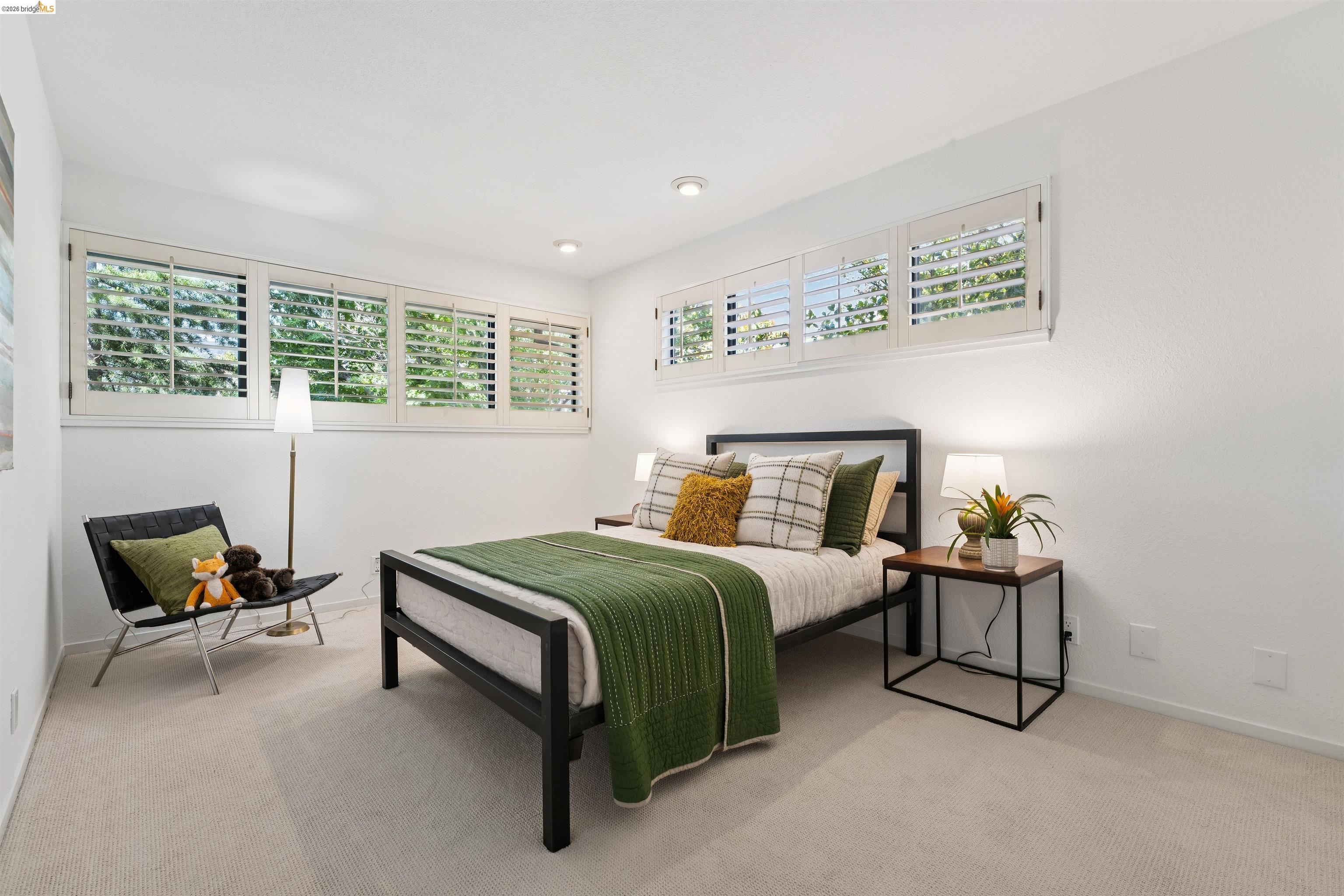 7 Jo Lin Court El Sobrante, CA 94803 - Photo 63 of 99 Well-lit room featuring multiple windows with plantation shutters, recessed lighting, and light-toned carpet flooring