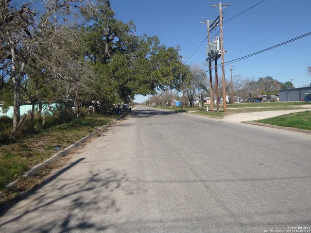 a view of a street with a building in the background