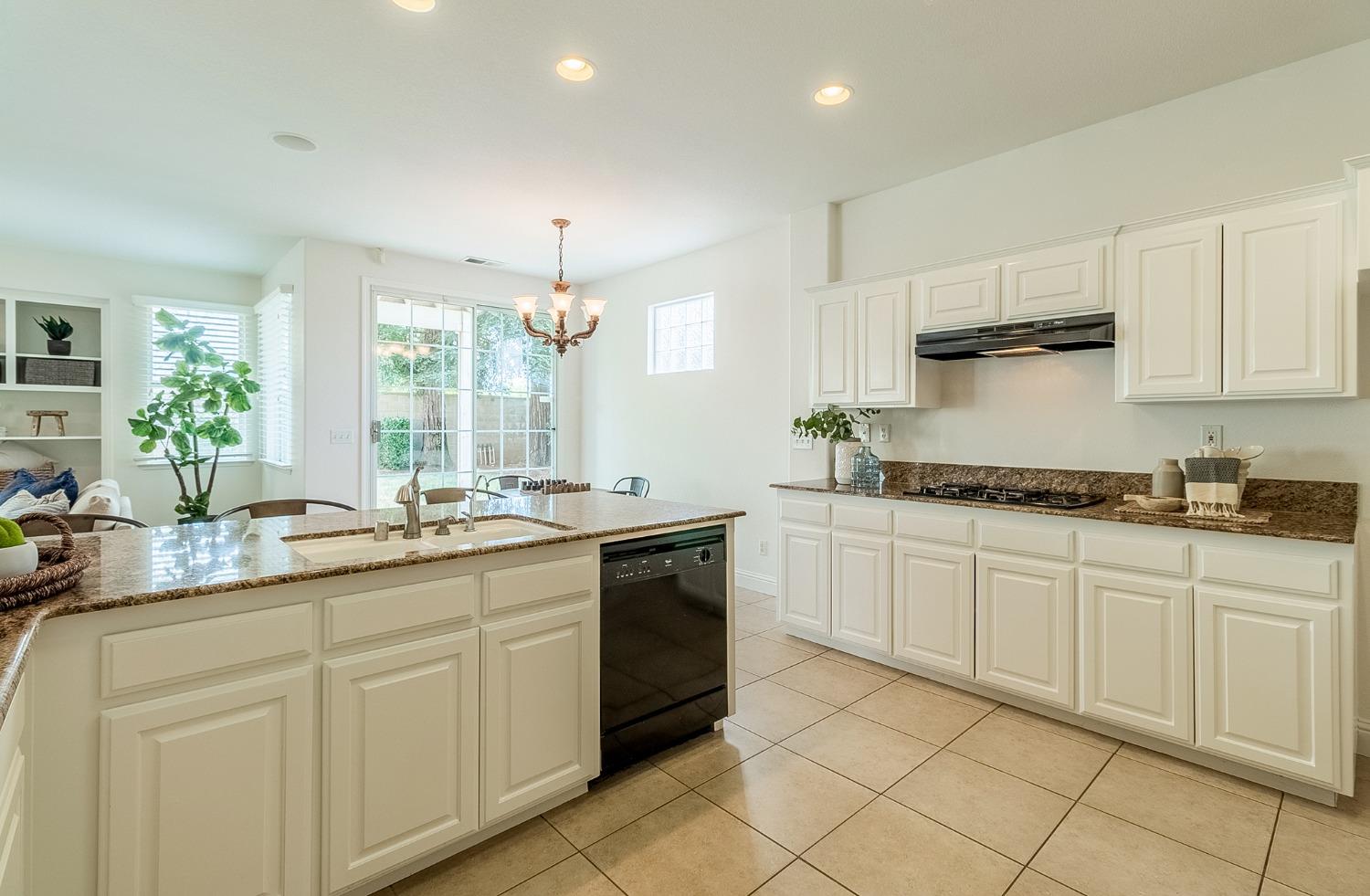 2595 Powers Avenue Coalinga, CA 93210 - Photo 14 of 34 a kitchen with a sink and cabinets