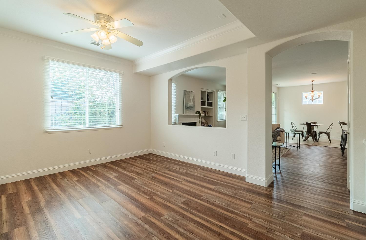 2595 Powers Avenue Coalinga, CA 93210 - Photo 18 of 34 wooden floor in an empty room with a window
