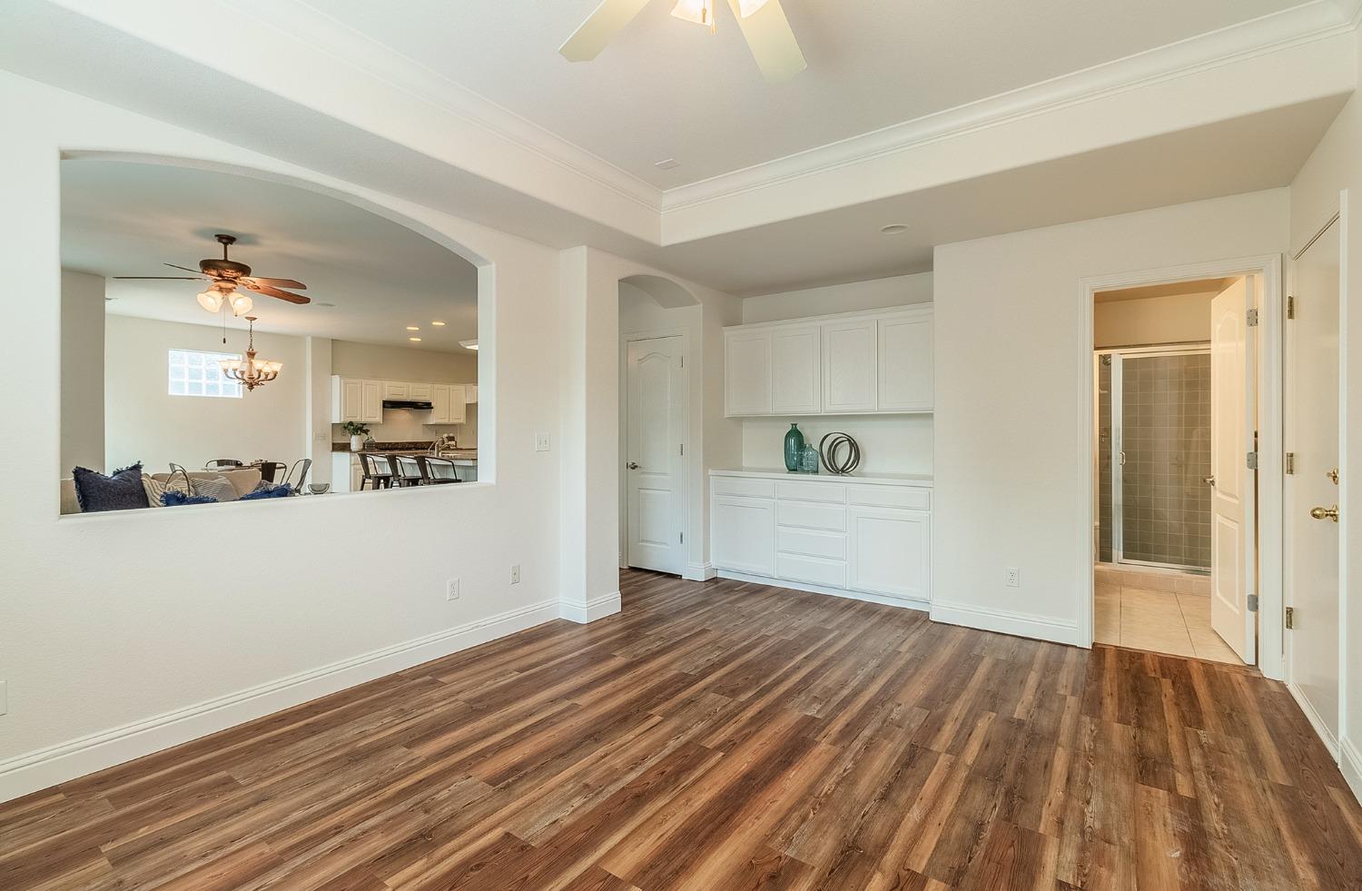 2595 Powers Avenue Coalinga, CA 93210 - Photo 19 of 34 a view of a hardwood floor in a room