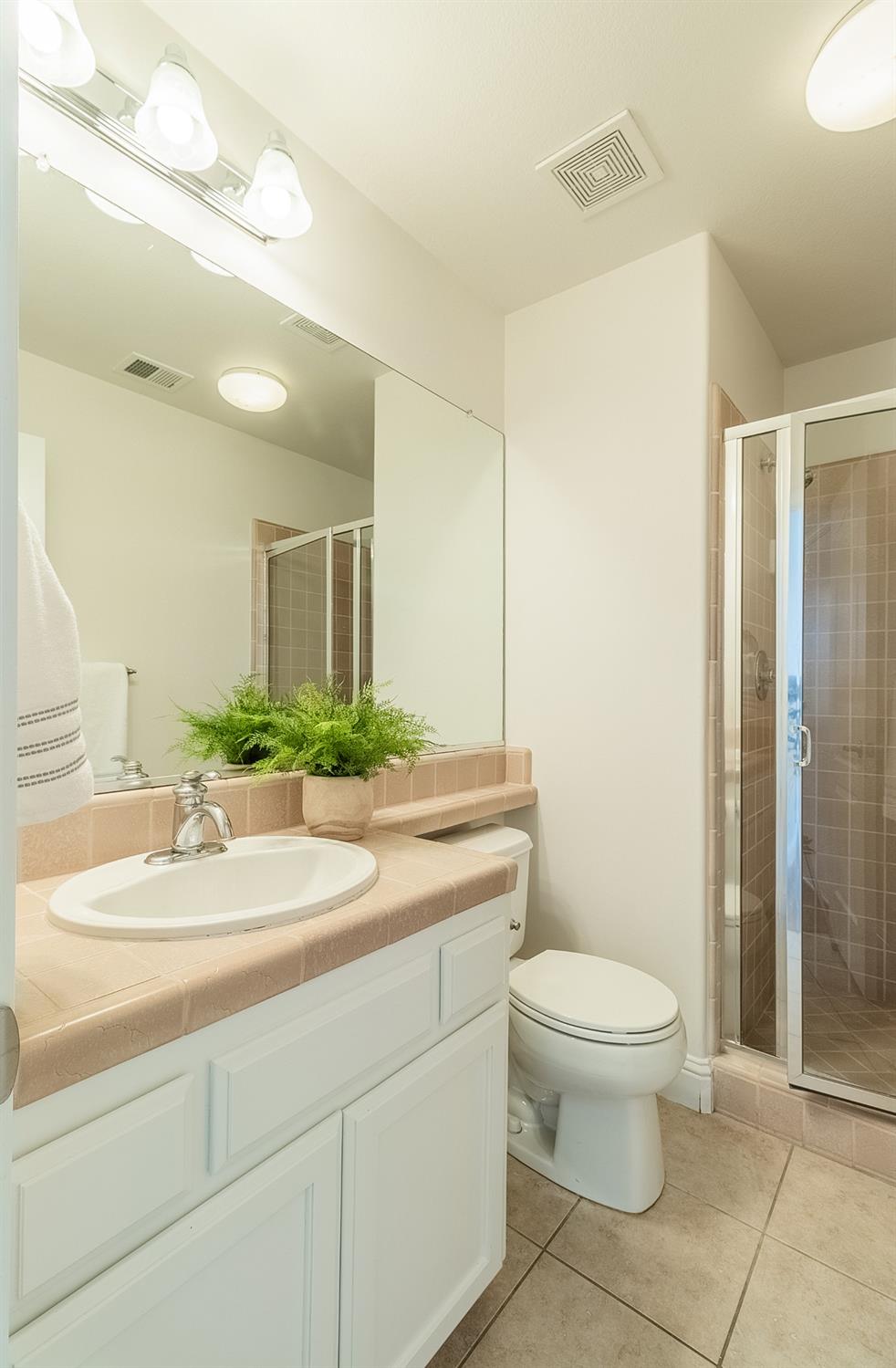 2595 Powers Avenue Coalinga, CA 93210 - Photo 20 of 34 a bathroom with a sink toilet and shower