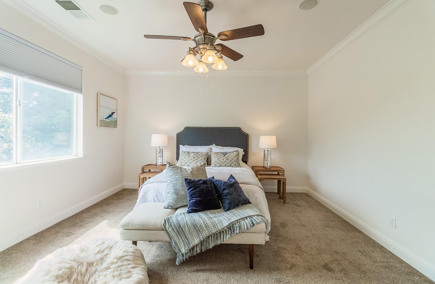2595 Powers Avenue Coalinga, CA 93210 - Photo 24 of 34 a bed room with a bed and a window