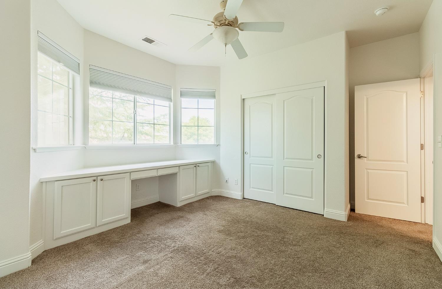 2595 Powers Avenue Coalinga, CA 93210 - Photo 31 of 34 a large white bathroom with a tub sink and vanity