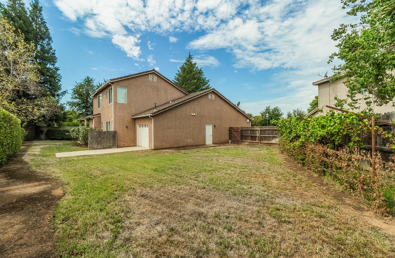 2595 Powers Avenue Coalinga, CA 93210 - Photo 34 of 34 a view of a house with backyard and garden