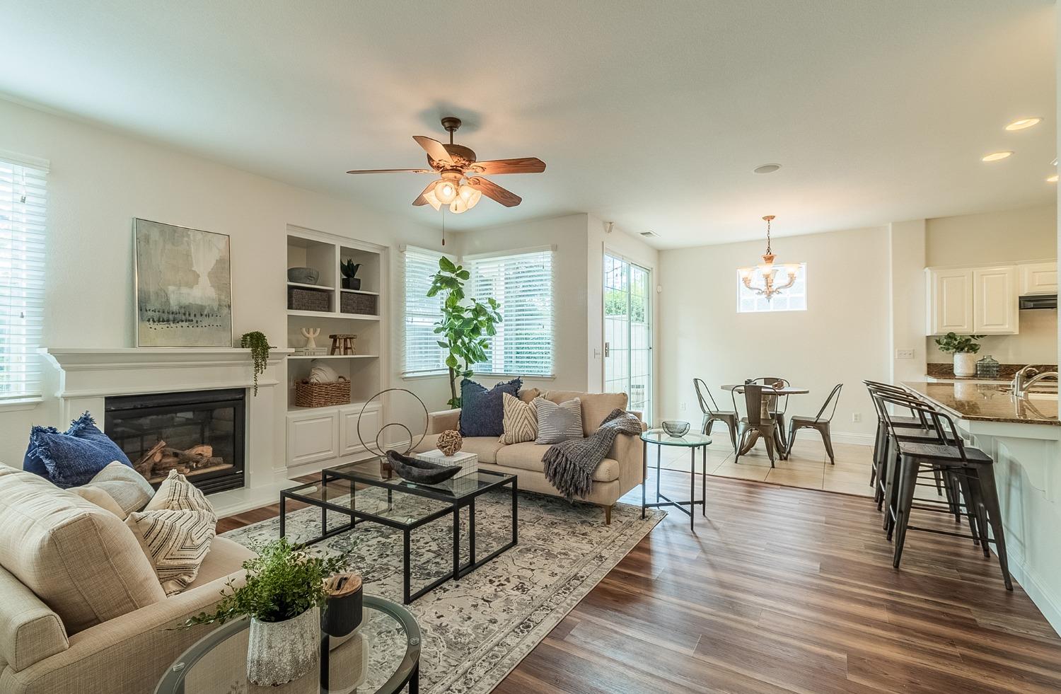 2595 Powers Avenue Coalinga, CA 93210 - Photo 6 of 34 a living room with furniture or kitchen and a fireplace