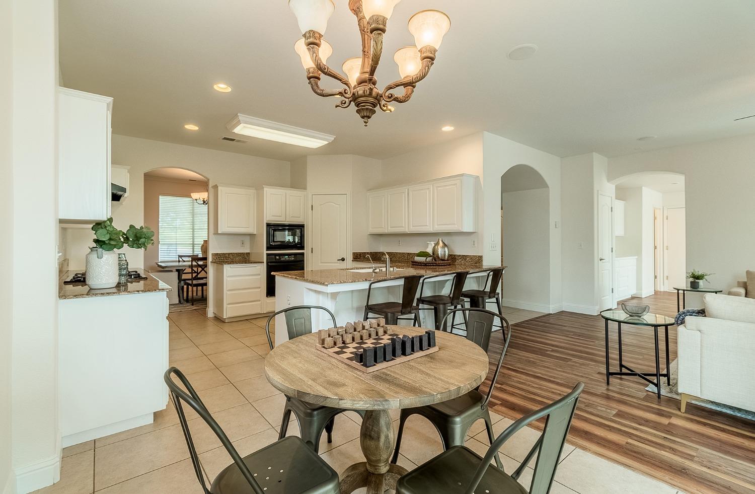 2595 Powers Avenue Coalinga, CA 93210 - Photo 10 of 34 a view of a dining room with furniture and wooden floor