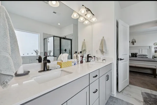 a bathroom with a sink and a mirror
