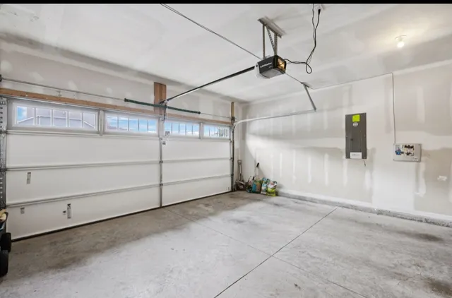 a living room with furniture ceiling fan and a large window