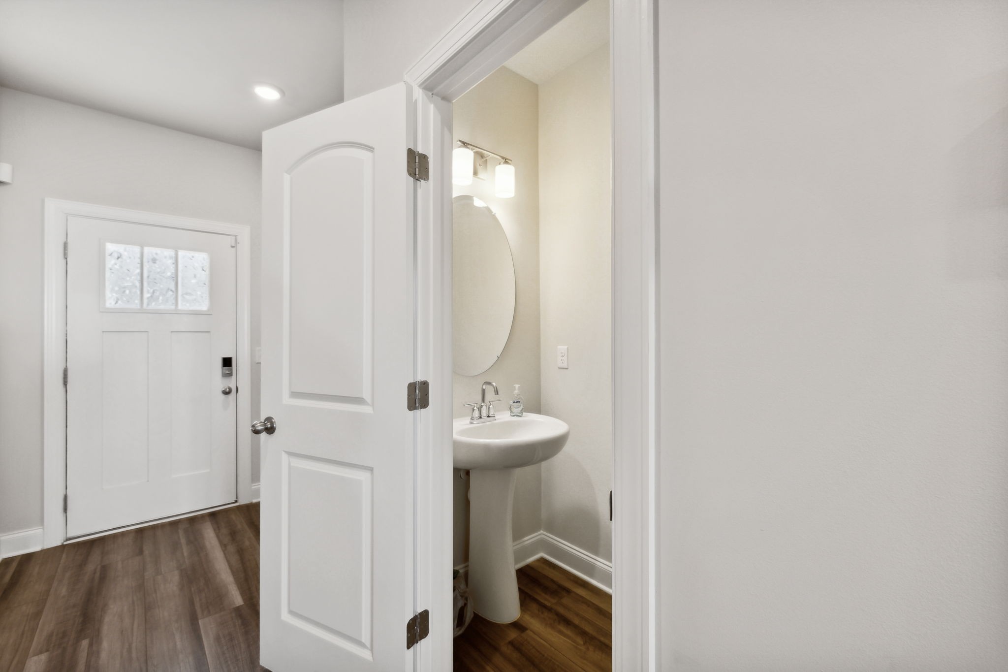 738 Prairie View Drive Columbia, TN 38401 - Photo 16 of 38 a view of a bathroom with sink mirror and wooden floor