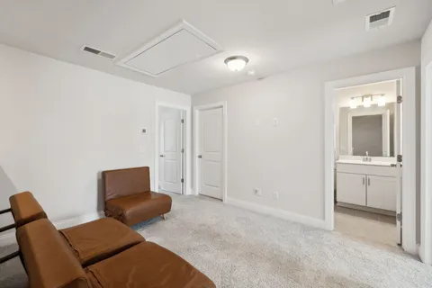 a hotel room with a bed and furniture