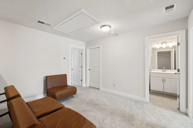 a hotel room with a bed and furniture