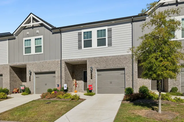 a front view of a house with yard