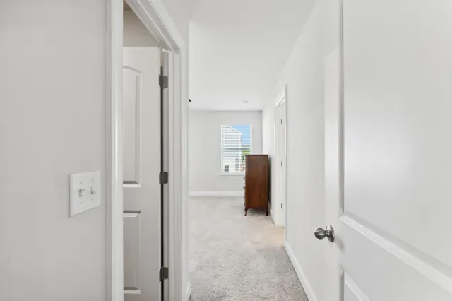 a view of a bathroom with mirror