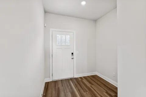 a view of a room with wooden floor and closet