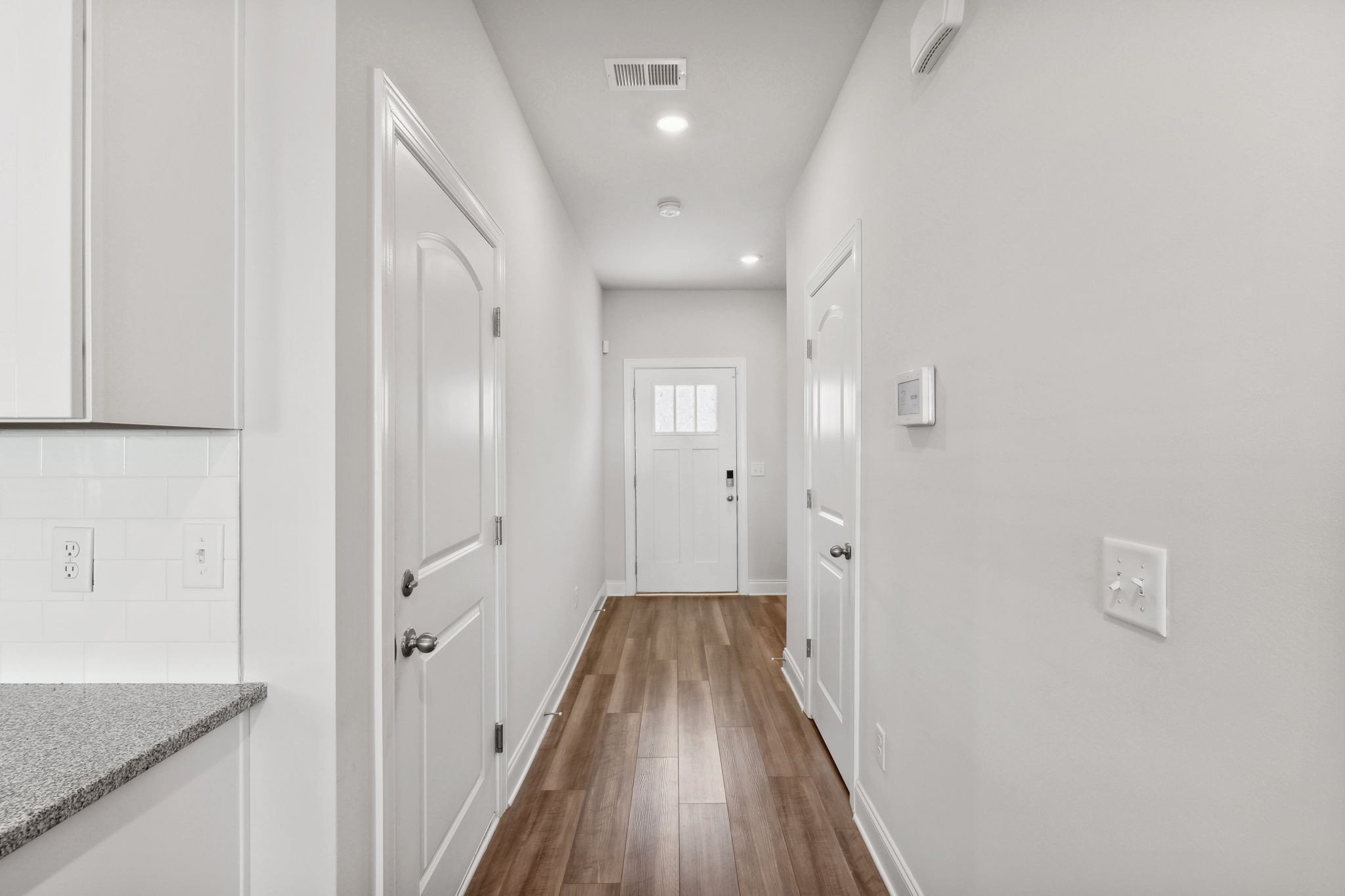 738 Prairie View Drive Columbia, TN 38401 - Photo 5 of 38 a view of a hallway with wooden floor and a bathroom