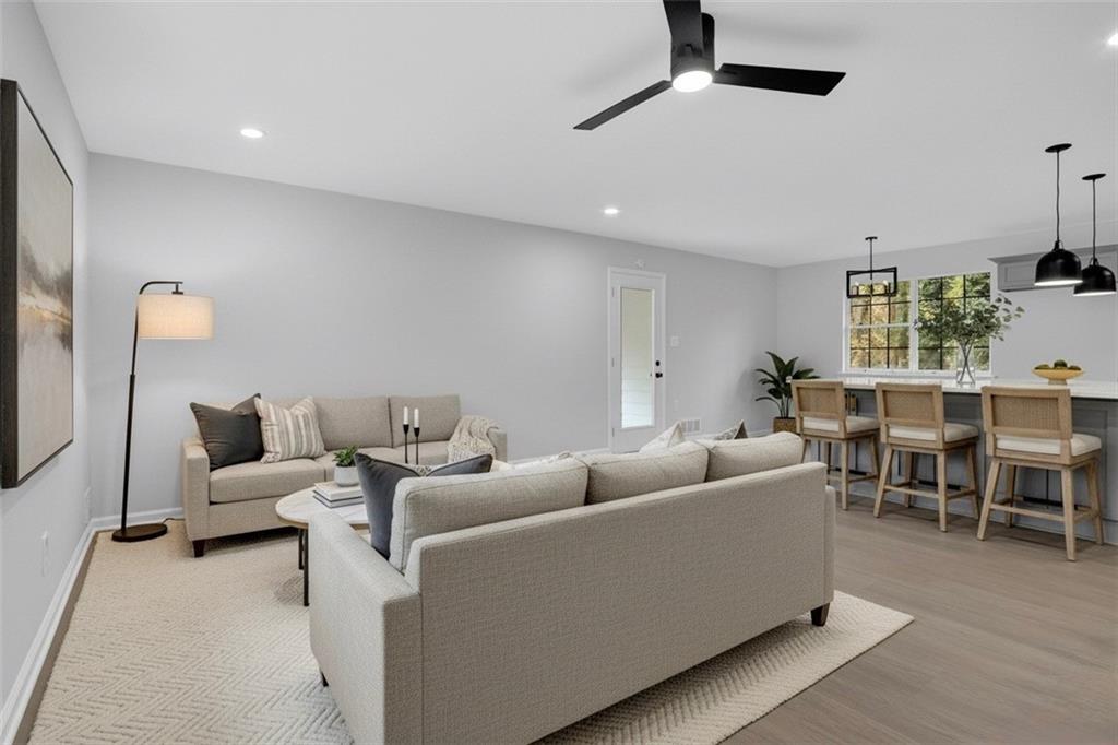 812 Raintree Way Southeast Conyers, GA 30094 - Photo 1 of 1 a living room with furniture and a table