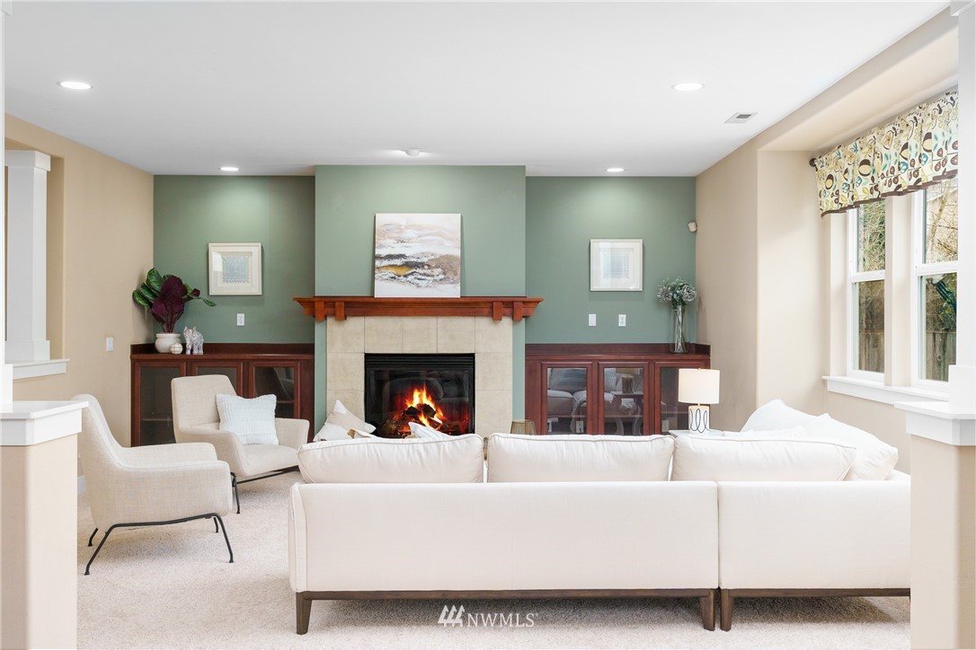 883 Jericho Place Northeast Renton, WA 98059 - Photo 13 of 30 a living room with furniture and a fireplace