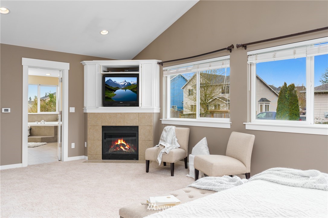 883 Jericho Place Northeast Renton, WA 98059 - Photo 20 of 30 a living room with furniture and a fireplace