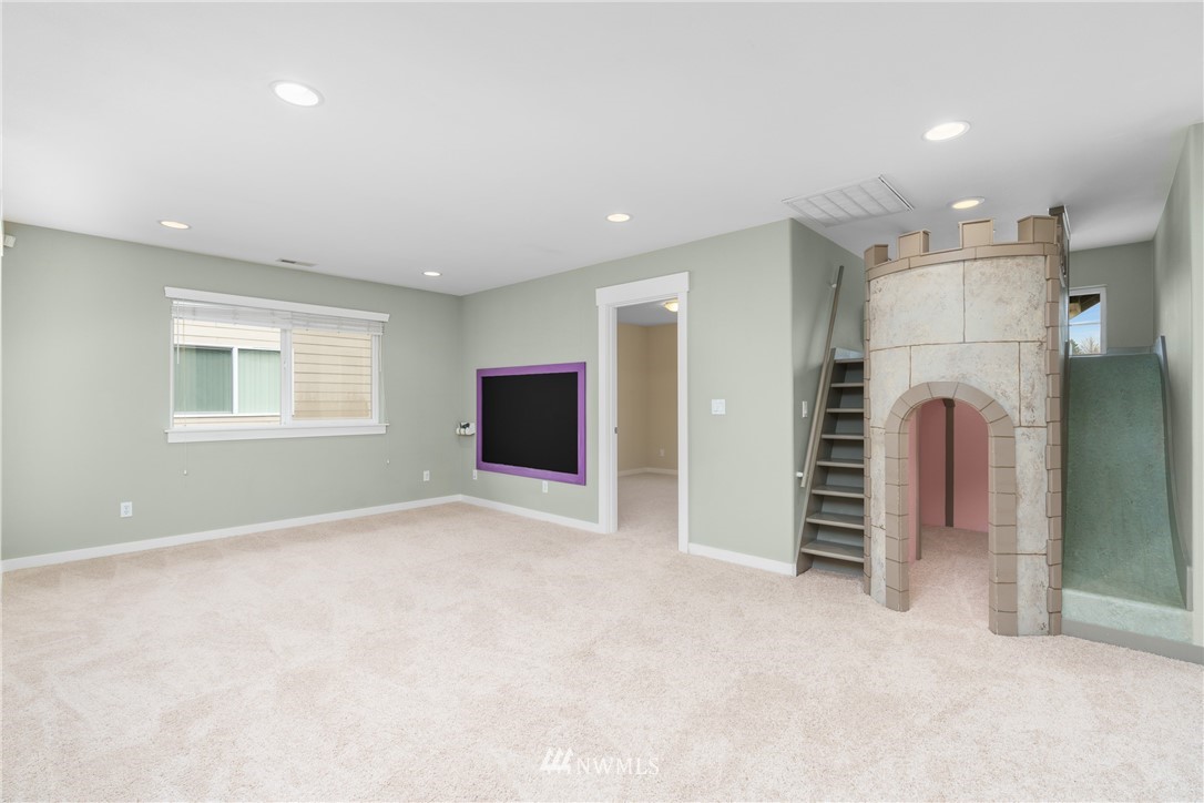 883 Jericho Place Northeast Renton, WA 98059 - Photo 23 of 30 a view of empty room with a fireplace