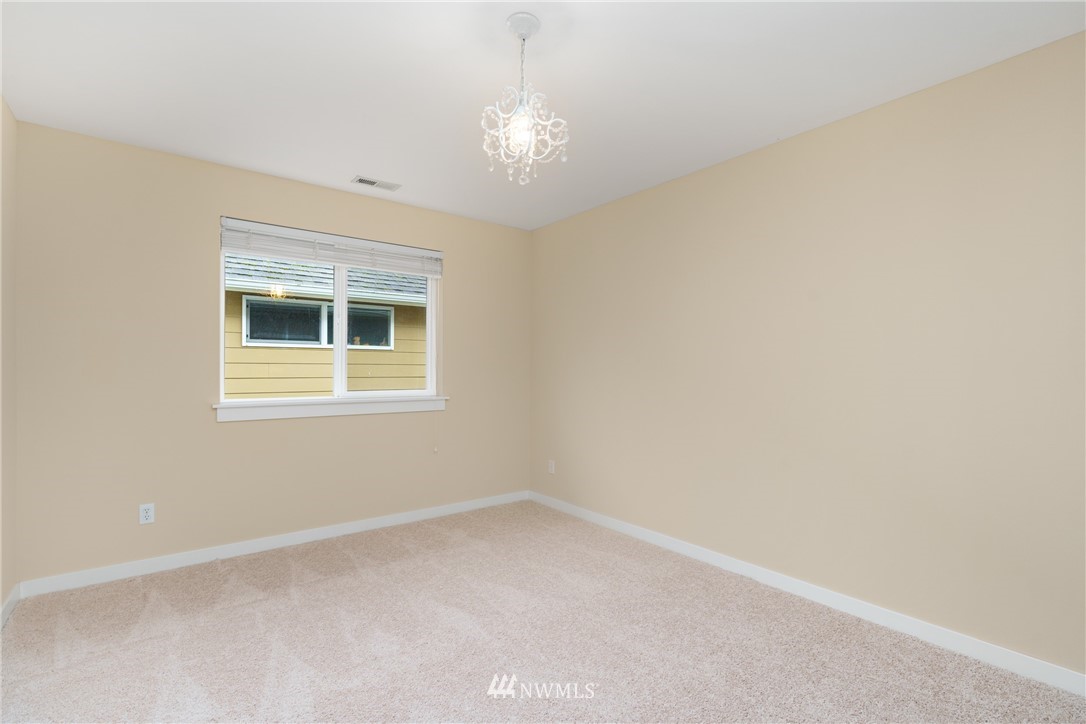 883 Jericho Place Northeast Renton, WA 98059 - Photo 27 of 30 a view of an empty room with a window