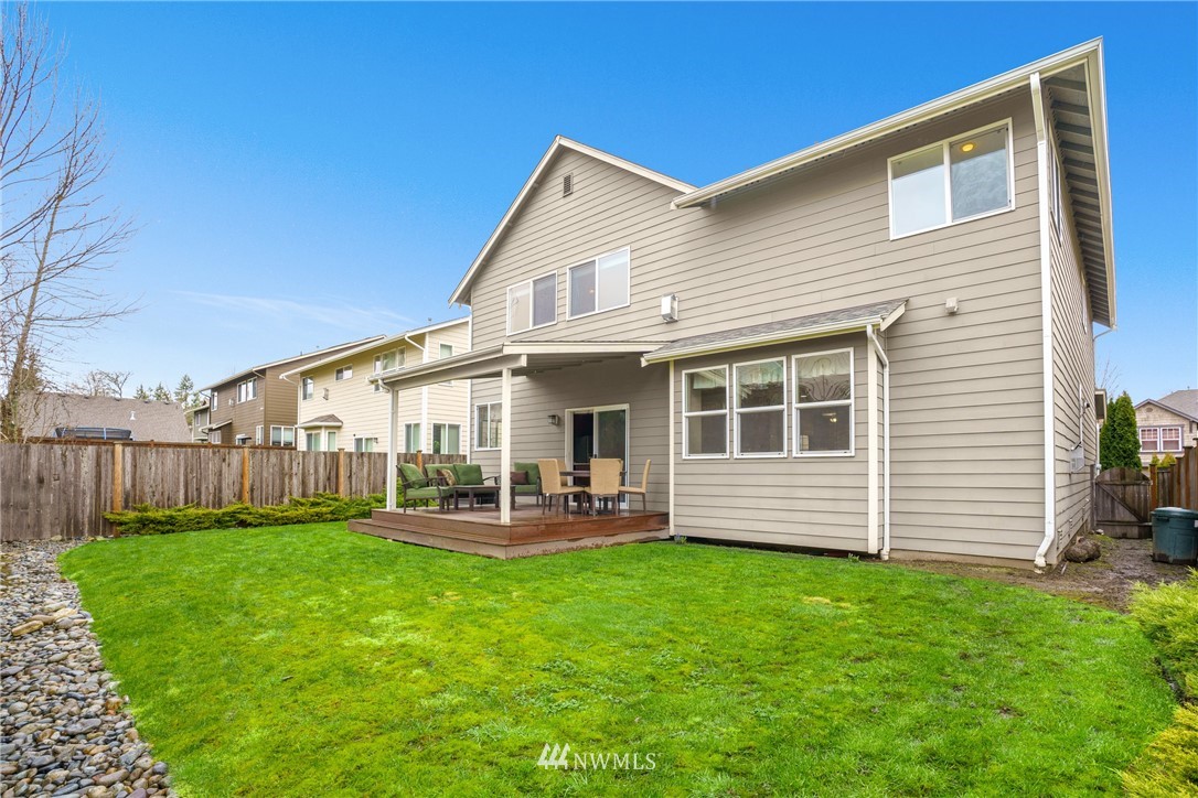883 Jericho Place Northeast Renton, WA 98059 - Photo 29 of 30 a front view of house with a yard and patio