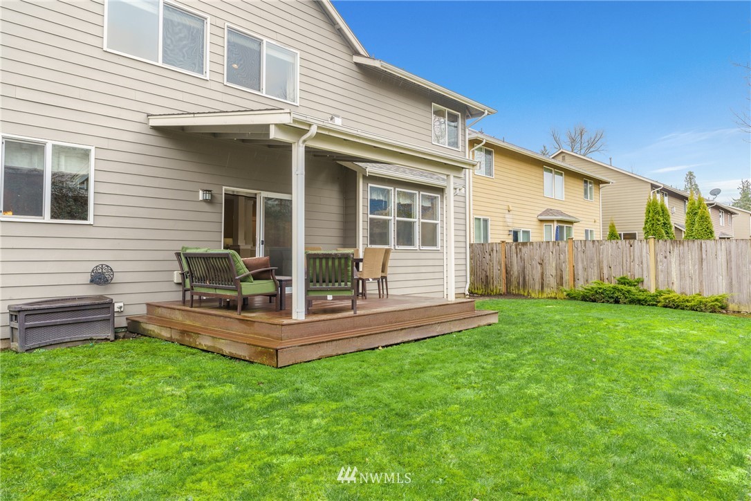 883 Jericho Place Northeast Renton, WA 98059 - Photo 30 of 30 a view of a house with backyard and sitting area