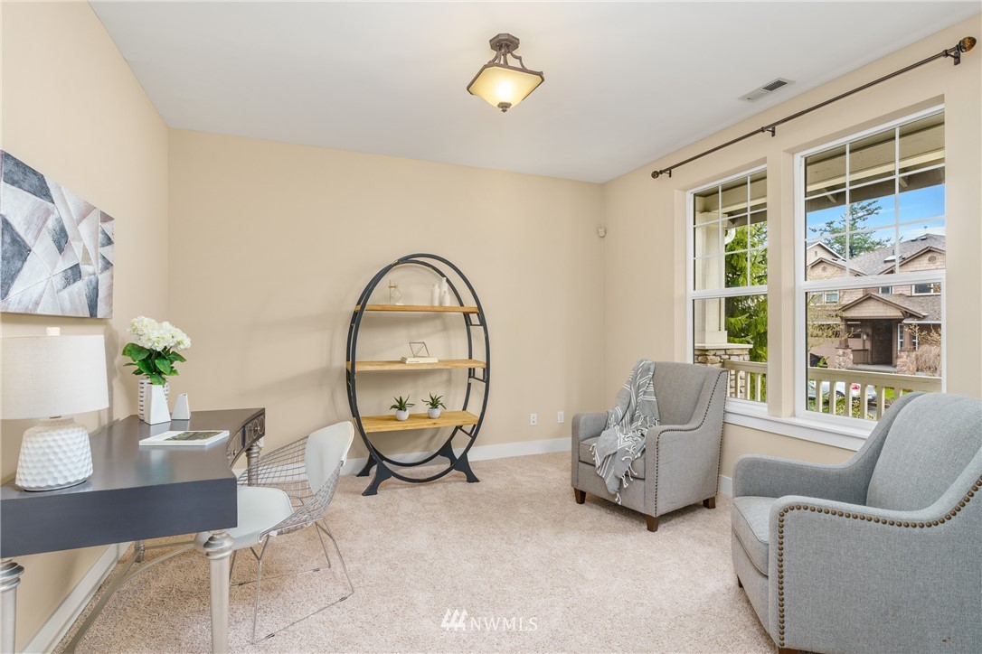 883 Jericho Place Northeast Renton, WA 98059 - Photo 4 of 30 a living room with furniture and a large window