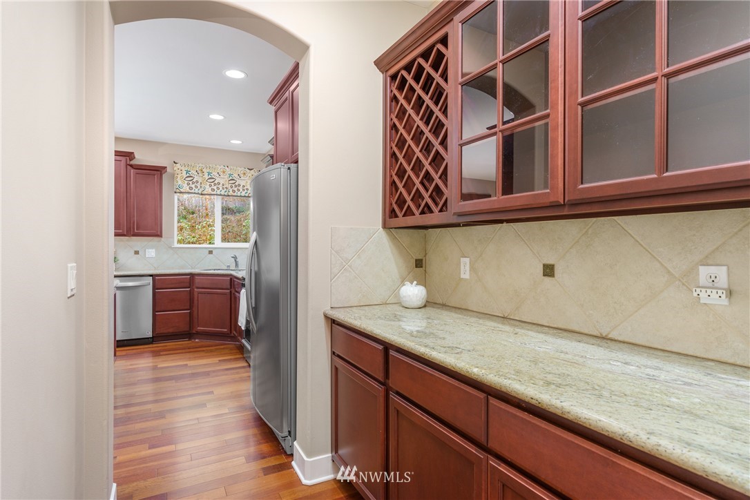 883 Jericho Place Northeast Renton, WA 98059 - Photo 6 of 30 a view of a kitchen cabinets and wooden floor
