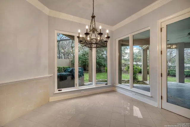 a kitchen with stainless steel appliances granite countertop white cabinets and a granite counter tops