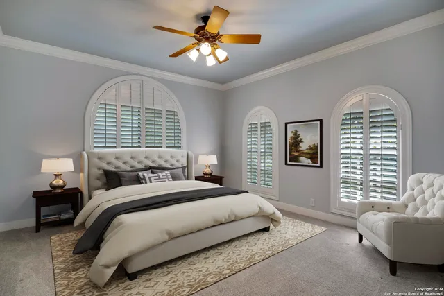 a bathroom with a granite countertop toilet a sink and a mirror
