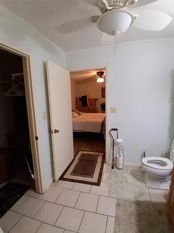 a bathroom with a sink a light fixture and a mirror