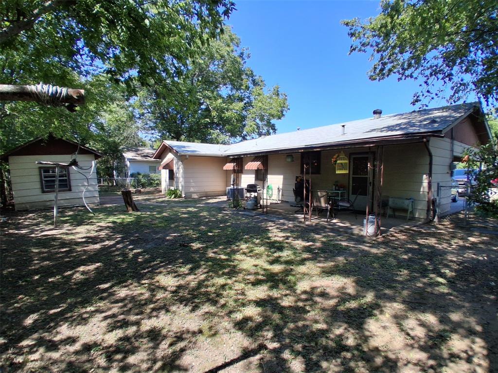 407 North Files Street Itasca, TX 76055 - Photo 23 of 30 Rear view of property featuring a patio area