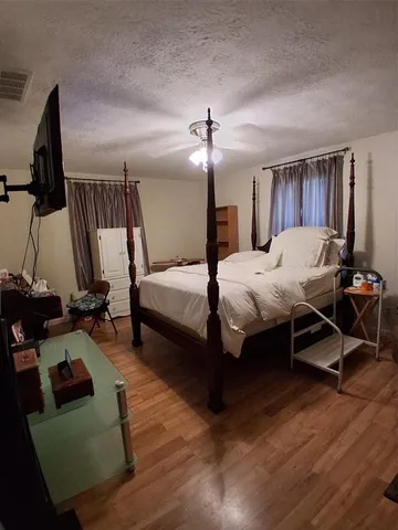 a bedroom with a bed and furniture