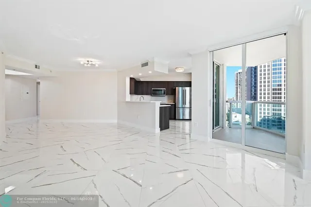 a view of a kitchen with a sink