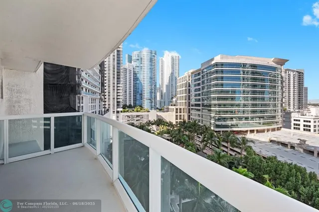 a view of city with tall buildings