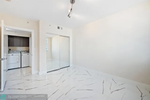 a living room with couches and a flat screen tv