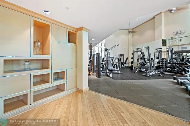 a living room with furniture and a mirror