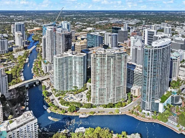a view of a backyard with plants and outdoor seating
