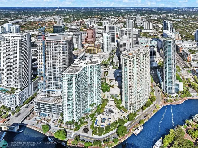 a vase of flowers sitting on a floor
