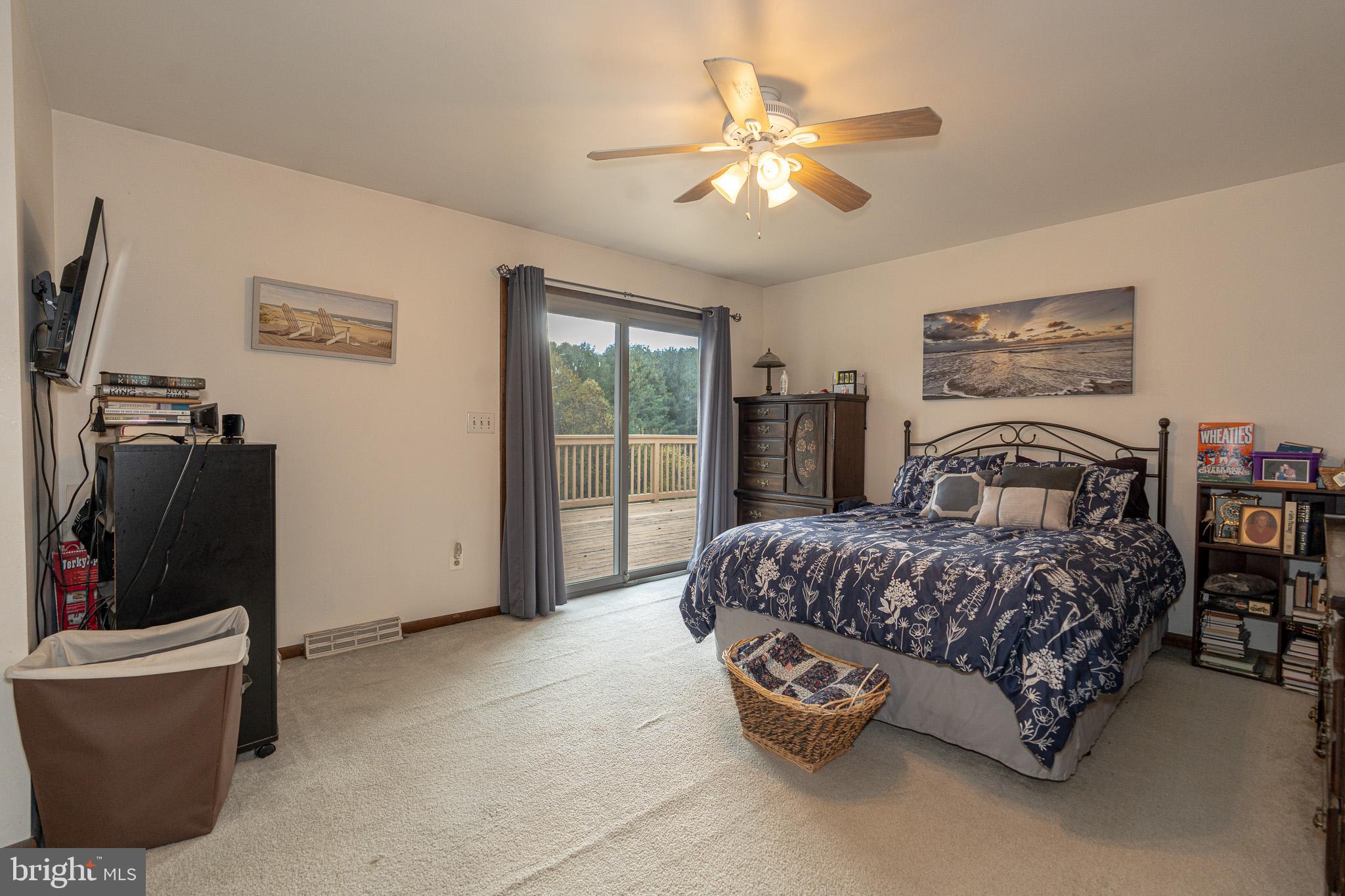 1913 Trout Farm Road Jarrettsville, MD 21084 - Photo 22 of 40 a bedroom with a bed and a chandelier