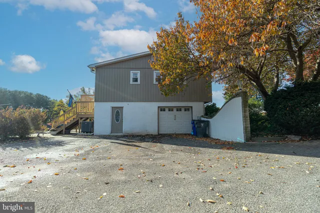 a view of a house with a snow in the yard