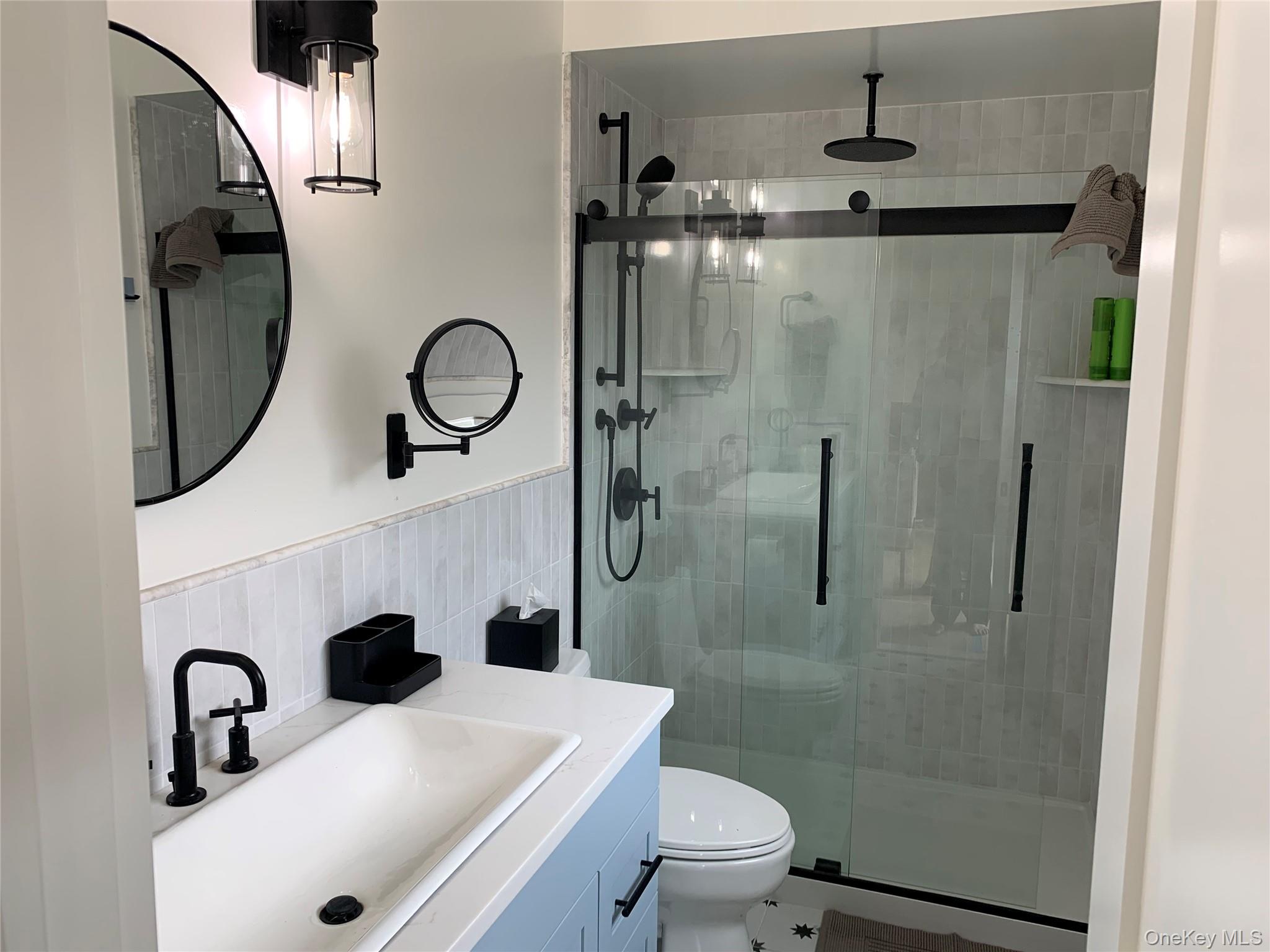 7 Atlantic Avenue Ocean Beach, NY 11770 - Photo 13 of 13 a bathroom with a sink toilet and shower