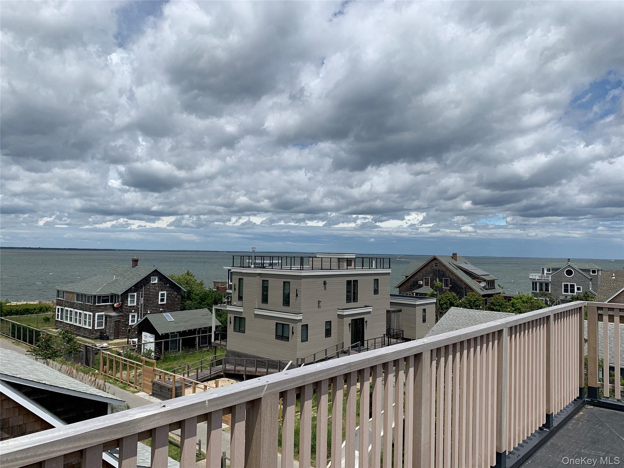7 Atlantic Avenue Ocean Beach, NY 11770 - Photo 2 of 13 a view of a balcony with city view