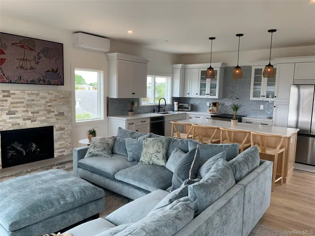 a living room with furniture and a fireplace
