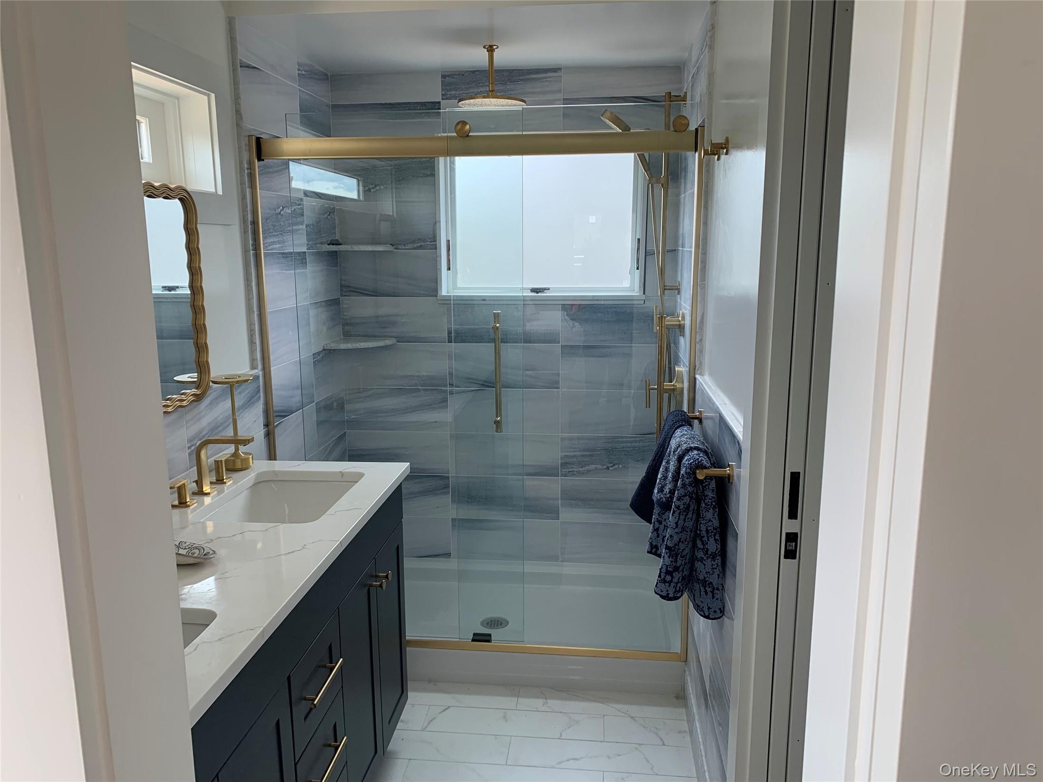 7 Atlantic Avenue Ocean Beach, NY 11770 - Photo 6 of 13 a bathroom with a sink and shower