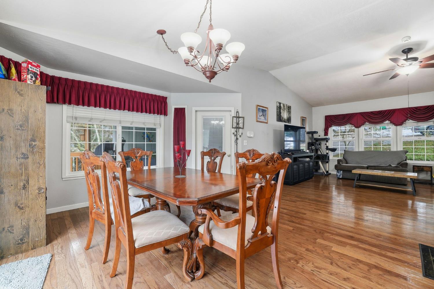 11002 Ball Road Grass Valley, CA 95949 - Photo 13 of 34 a dining room with furniture a chandelier and wooden floor