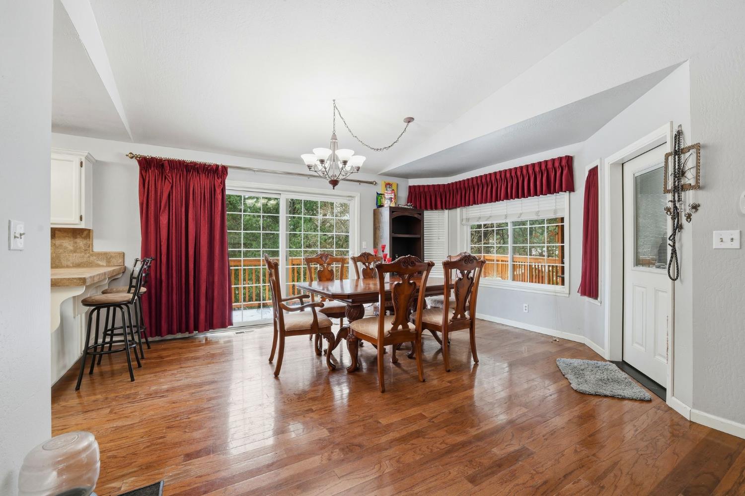 11002 Ball Road Grass Valley, CA 95949 - Photo 14 of 34 a view of a dining room with furniture window and wooden floor