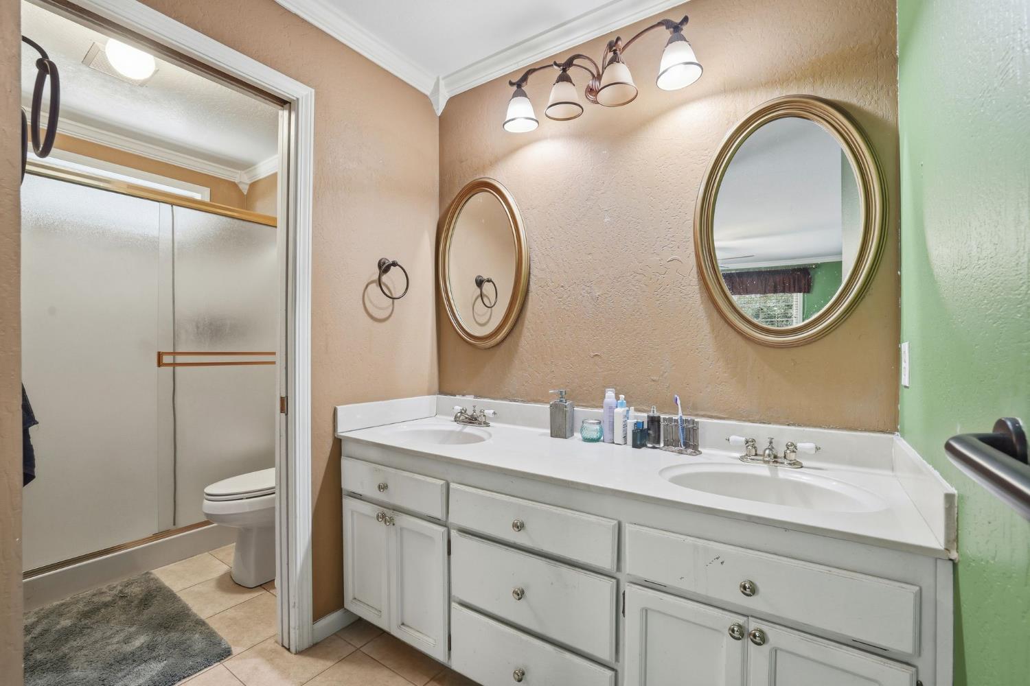 11002 Ball Road Grass Valley, CA 95949 - Photo 20 of 34 a bathroom with a double vanity sink and a mirror