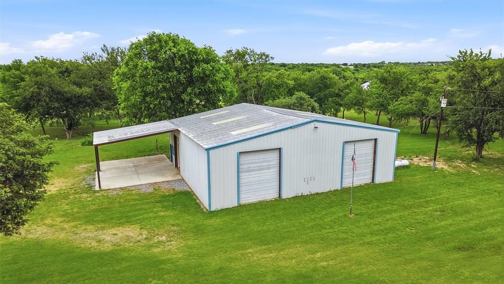 2700 Randell Lake Road Denison, TX 75020 - Photo 13 of 39 a view of a backyard with barn